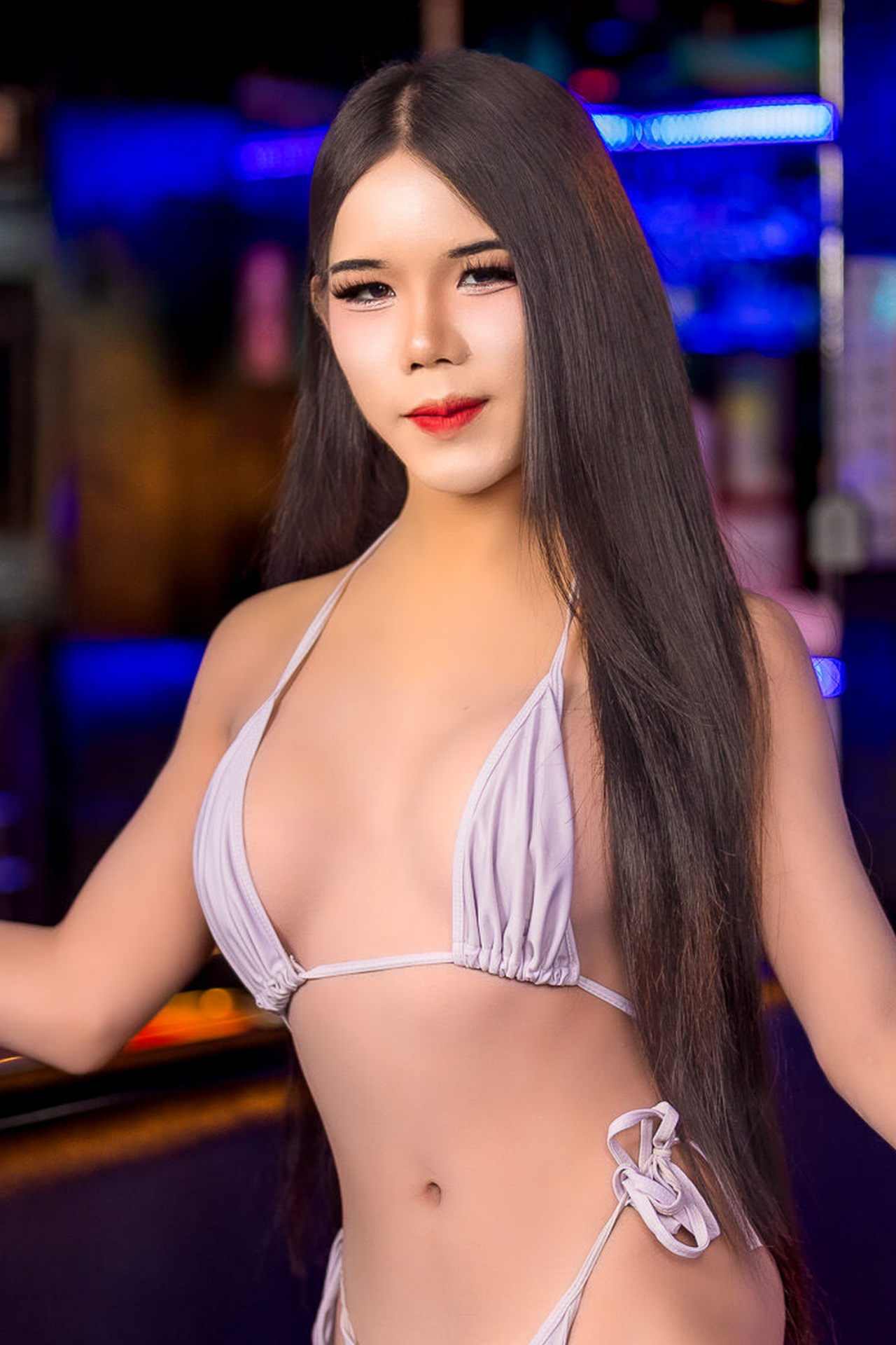 Peachy's LB Lounge gallery portrait under blue lighting